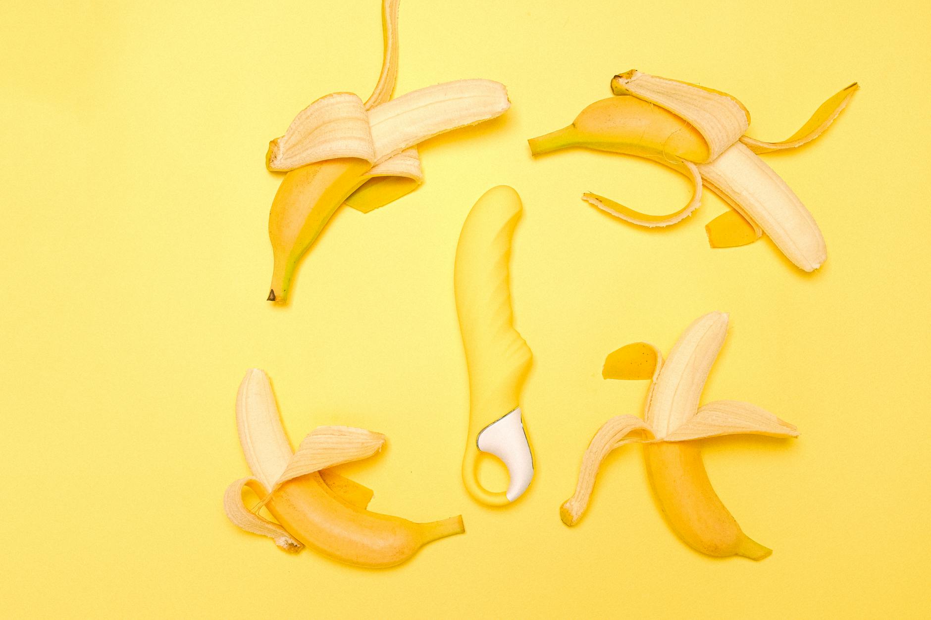 Hands holding a sleek lemon clitoral vibrator, symbolizing the bridge between pleasure and intimacy